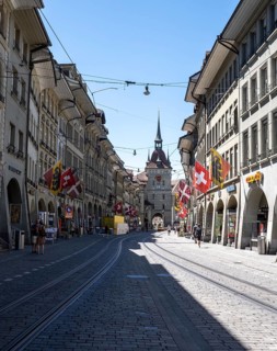 Flags on a row of houses in the old town of Bern