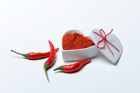 Chili powder in bowl with heart shape