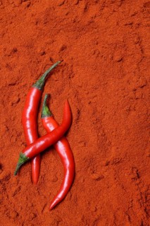 Red chilli peppers in chilli powder