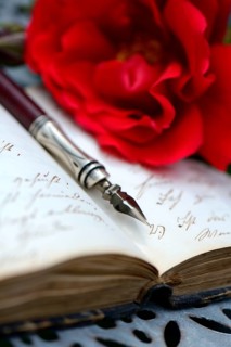 Penholder on book with old writing