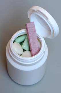 Various chewing gums in containers