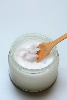 Coconut oil with bamboo spatula