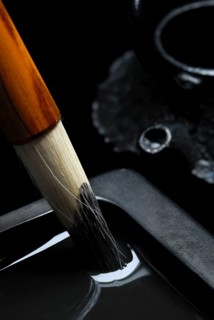 Brush with rubbing stone and water jar