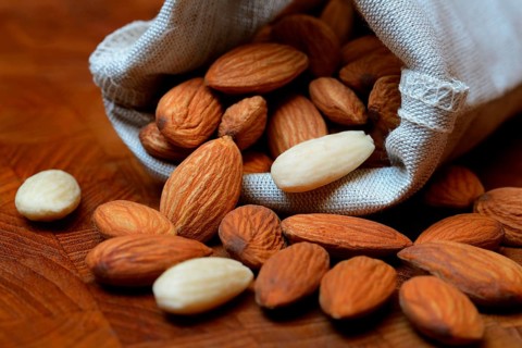 Sweet almonds in linen bags
