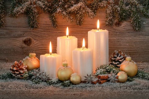 Natural advent decoration with 4 burning candles