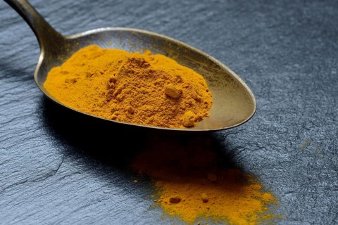 Curcuma powder in spoon