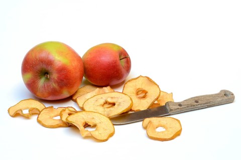 Dried apple slices with knife