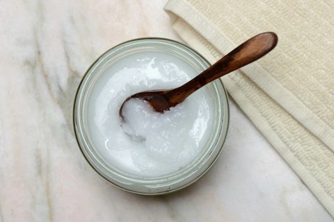 Coconut oil with wooden spoon