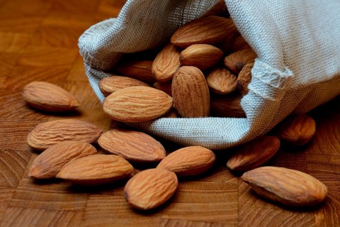 Sweet almonds in linen bags