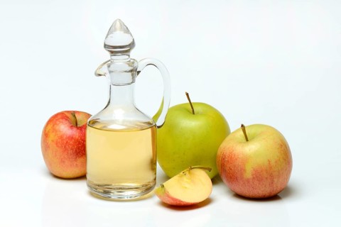 Carafe with apple vinegar and apples