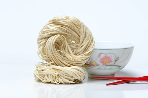 Chinese noodles and bowl with chopsticks
