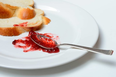 Jam and slice of braided butter