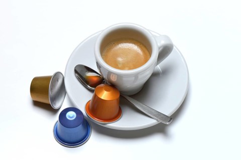 Coffee capsules and coffee cup with espresso