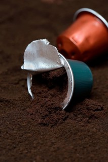 Opened coffee capsule and coffee powder