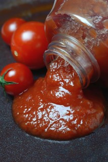 Tomato ketchup flows from bottle