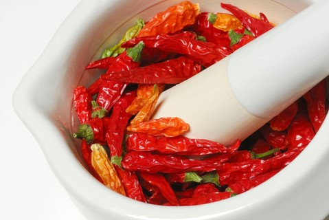 Dried chilli peppers in grating bowl