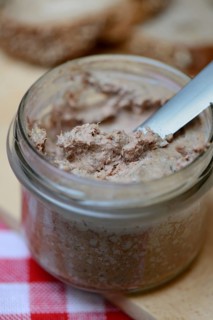 Liver sausage in glass with knife