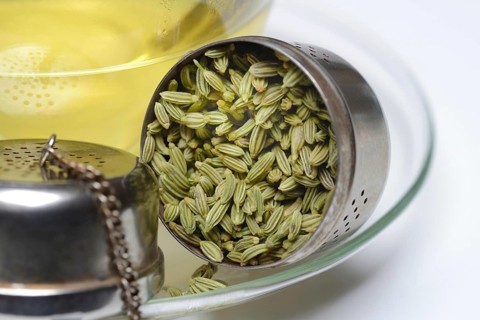 Fennel tea in cup and fennel seeds in spoon