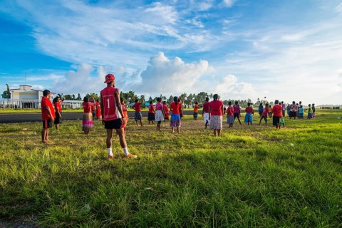 Villagers play volleyball together