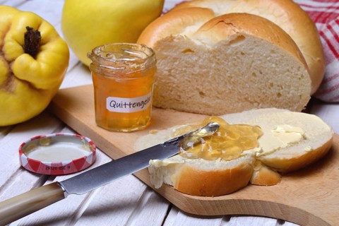 Slice of butter plait with quince jelly