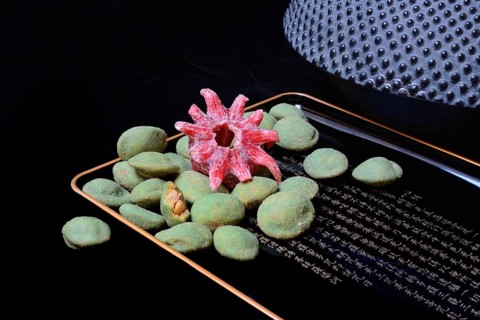 Wasabi peanuts and candied hibiscus flower