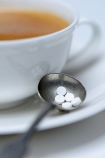 Sweetener tablets and coffee cup