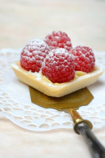 Patisserie with raspberries on a cake server
