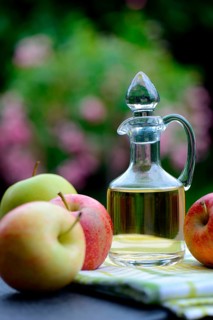 Carafe with apple vinegar and apples