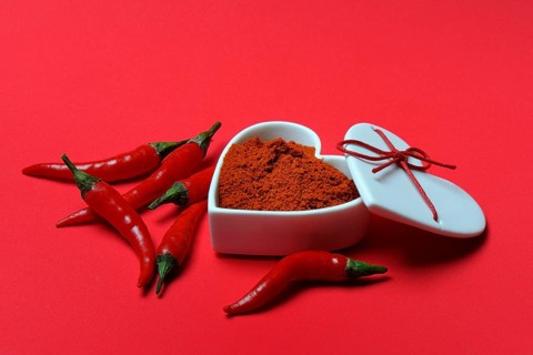Chili powder in bowl with heart shape