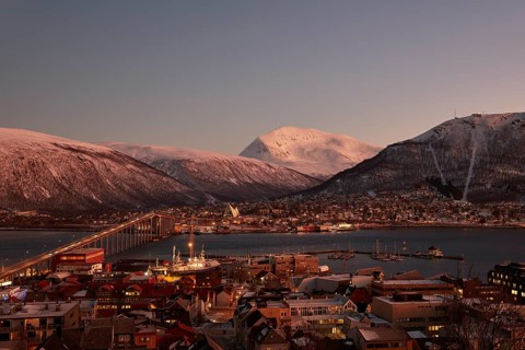 View of the harbour and the city with Tromso Bridge and Ice Sea Cathedral