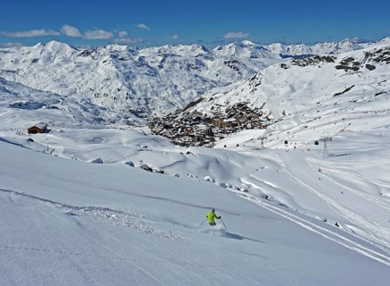 Skier skiing in deep snow