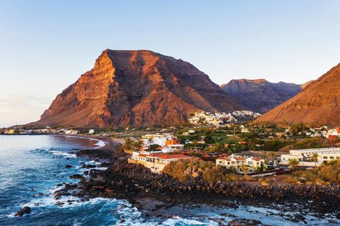 Holiday houses on the coast in the evening light