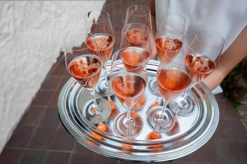Glasses of champagne served on a silver tray