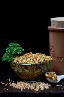 Grainy Dijon mustard in glass bowl