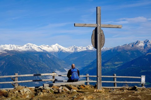 Hiker at the summit cross