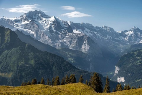 Snow covered mountain peaks behind Lauterbrunnen valley