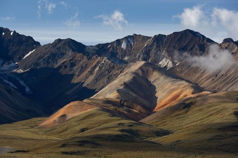 View of the Alaska Range with multicolored volcanic rock formations