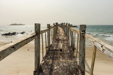 Old wooden pier in the Tokeh Beach