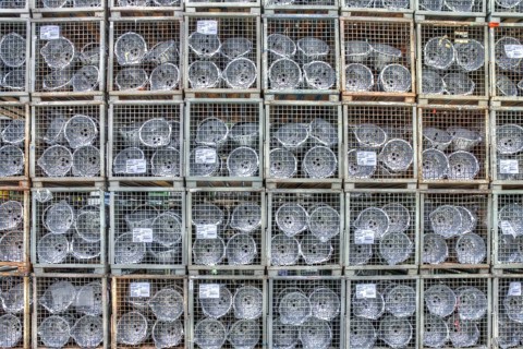 Car parts in the pallet cage in the warehouse