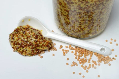 Grainy mustard with porcelain spoon