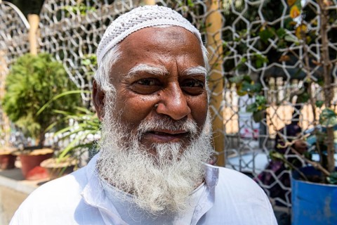 Imam in front of the Star Mosque