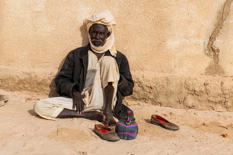 Old man before a mosque in a village at Ounianga kebir part of the the Unesco sight Ounianga lakes