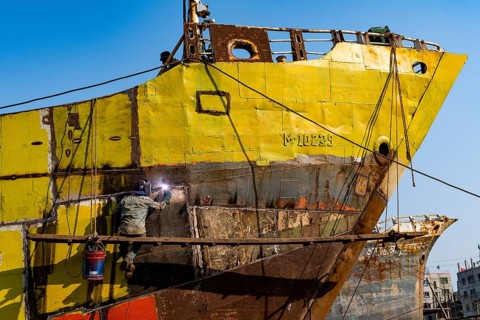 Man welding on a ship