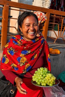 Women vendors selling grapes