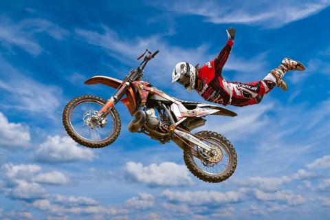 Motocross motorcycle and rider in the air