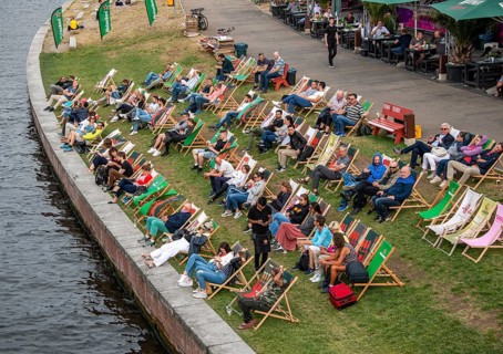 People sitting in deck chairs at the Spree