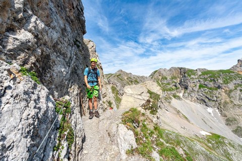 Mountaineer on a secured fixed rope route