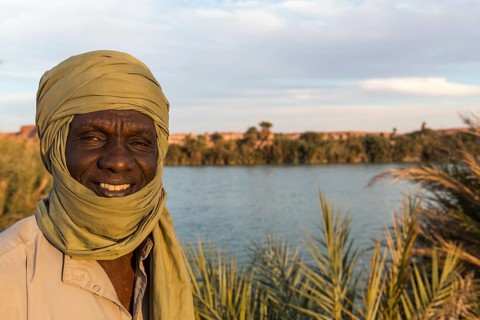 Beduin at the shore of Ounianga kebir part of the the Unesco sight Ounianga lakes