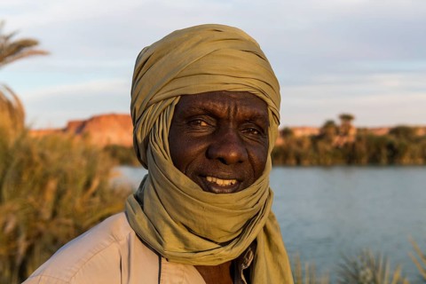 Beduin at the shore of Ounianga kebir part of the the Unesco sight Ounianga lakes