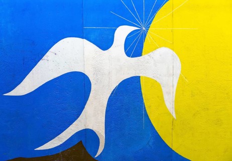 Graffiti Dawn Of Peace with white peace dove in front of sun
